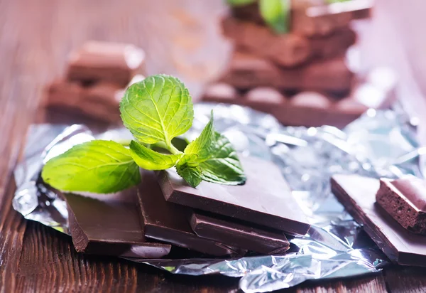 Chocolate with mint on table — Stock Photo, Image