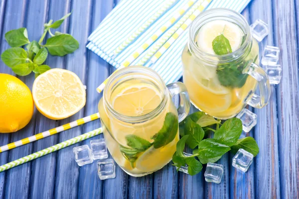 Lemonade jars on table — Stock Photo, Image