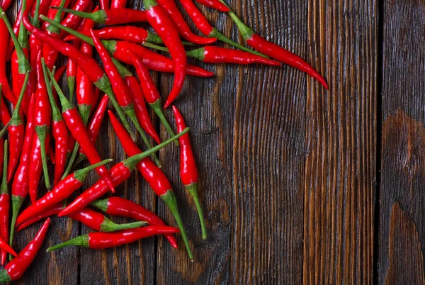 Hot chillies on table — Stock Photo, Image