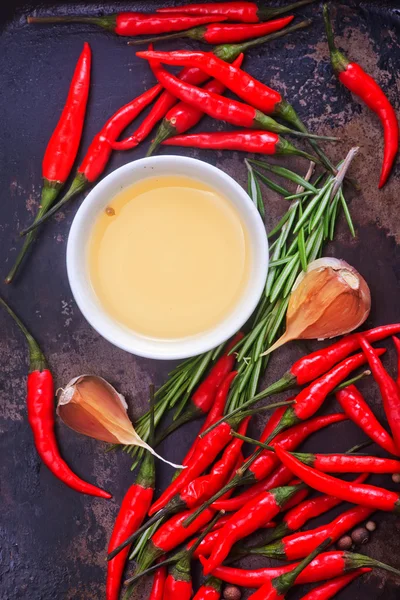 Chilli peppers and spices — Stock Photo, Image