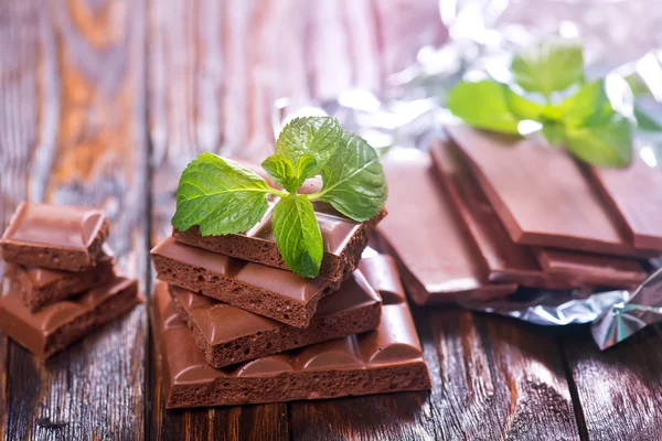 Chocolate with mint on table — Stock Photo, Image