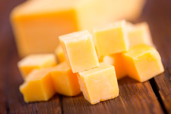 Sliced cheddar cheese — Stock Photo, Image