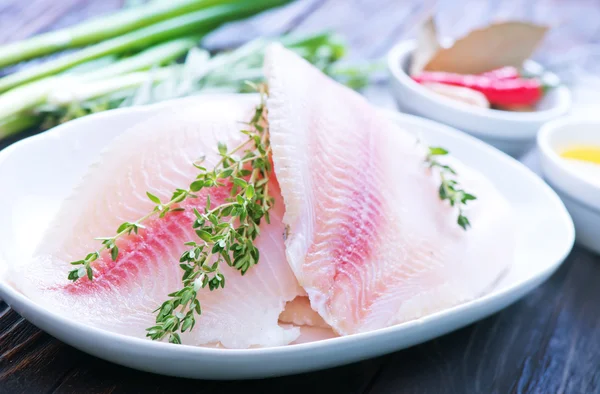 Raw fish fillet with spices — Stock Photo, Image