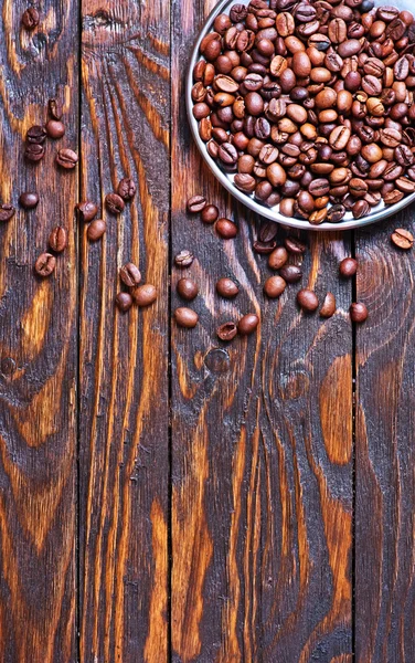 Coffee beans on metal plate — Stock Photo, Image