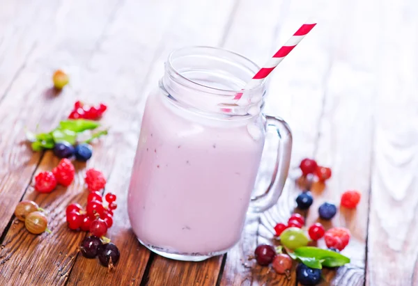 Glass of yogurt with berries — Stock Photo, Image