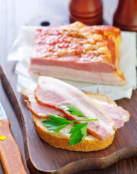 Pieces of smoked pork bacon — Stock Photo, Image