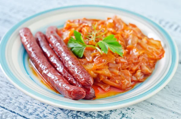 Fried cabbage with sausages — Stock Photo, Image