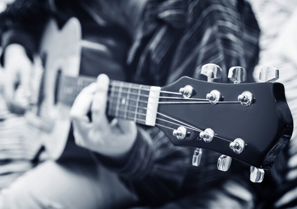 Man playing on guitar