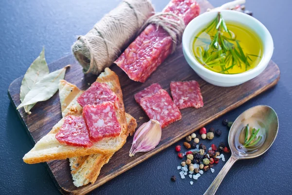 Salami and basil — Stock Photo, Image