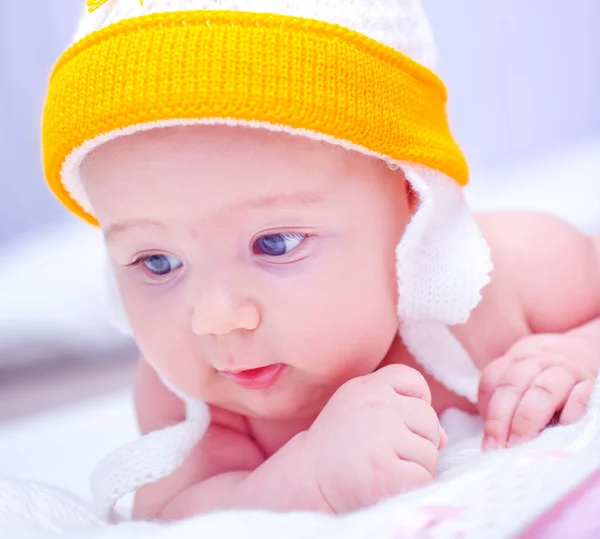 Little baby in yellow hat — Stock Photo, Image