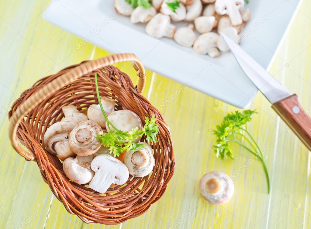 Raw mushrooms in basket