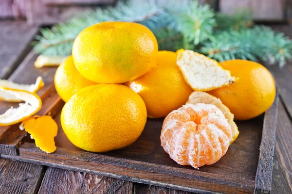 Tangerines and christmas decoration — Stock Photo, Image