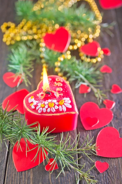 Red candle and christmas decorations — Stok fotoğraf