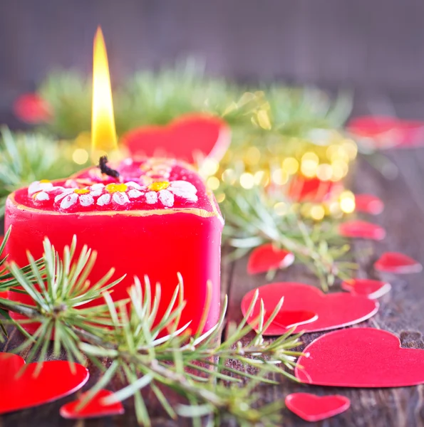 Red candle and christmas decorations — Stok fotoğraf