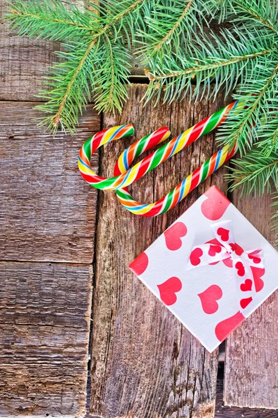 Branch of christmas tree and candy — Stock Photo, Image