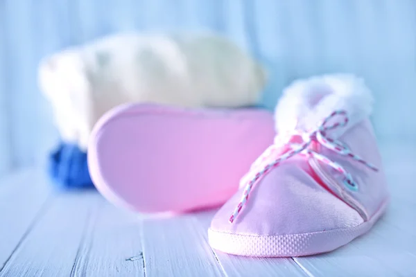 Baby clothes on a table — Stock Photo, Image