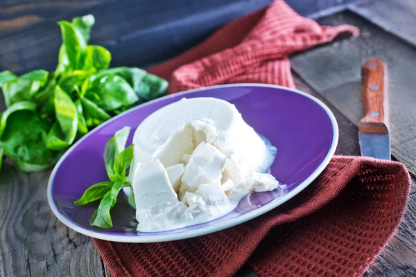 Fresh ricotta with basil — Stock Photo, Image