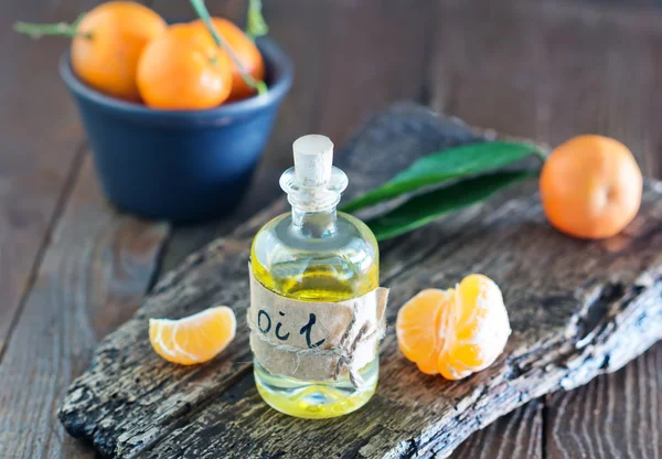 Aroma oil and tangerines — Stock Photo, Image
