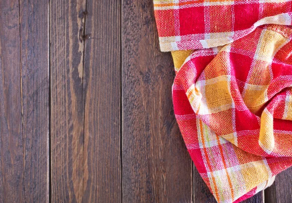 Wooden board and red napkin — Stock Photo, Image