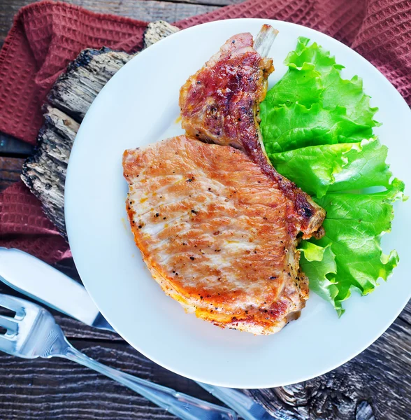 Fried steak on white plate — Stock Photo, Image