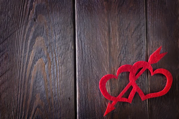 Red hears on the wooden table — Stock Photo, Image