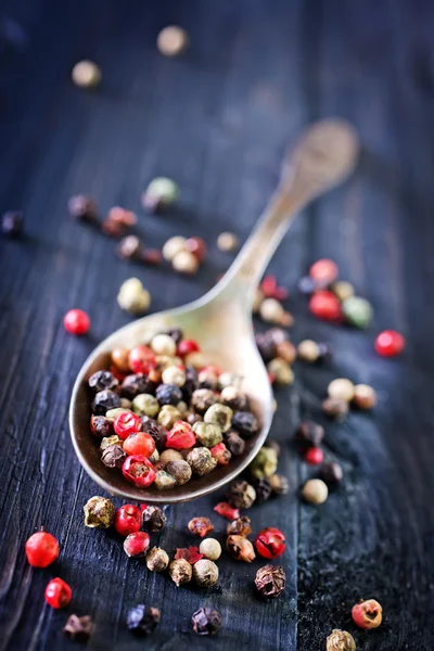 Pepper mix in metal spoon — Stock Photo, Image