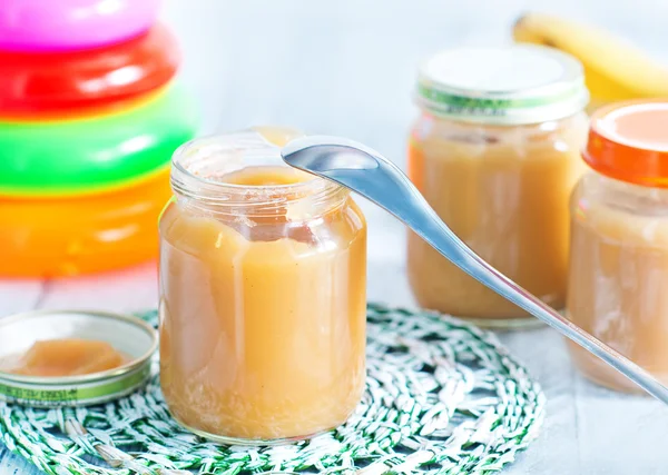 Baby food in bank — Stock Photo, Image