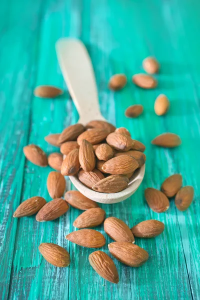 Almond in spoon — Stock Photo, Image