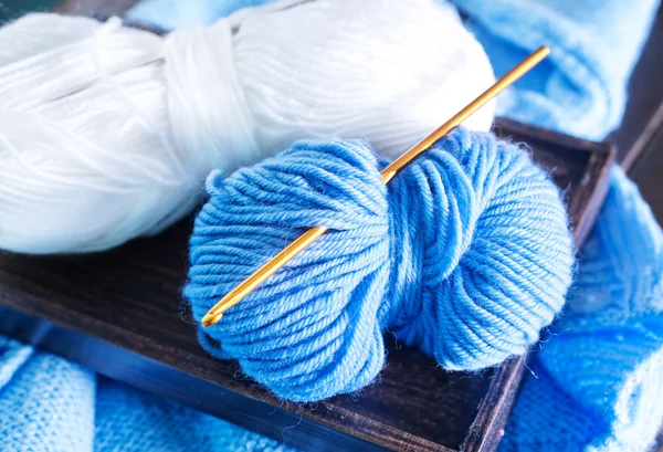 Knitting on wooden tray — Stock Photo, Image