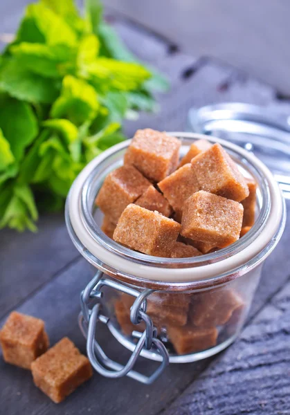 Reed sugar in glass jar — Stock Photo, Image