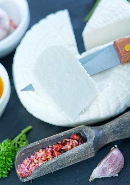 Cheese with olives and oil — Stock Photo, Image