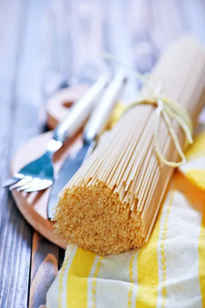 Raw spaghetti  on napkin — Stock Photo, Image