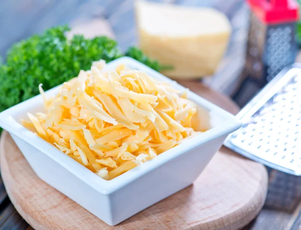 Grated cheese in bowl — Stock Photo, Image