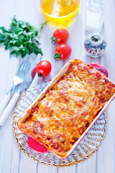 Tasty lasagna in bowl — Stock Photo, Image