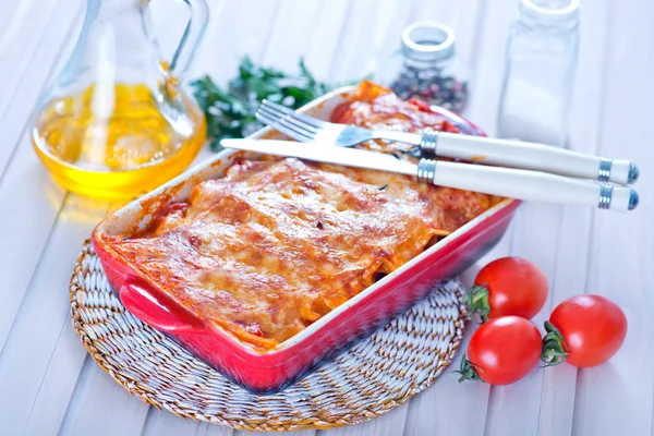 Tasty lasagna in bowl — Stock Photo, Image