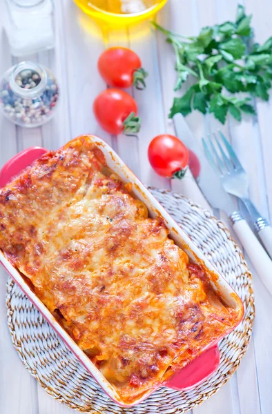 Tasty lasagna in bowl — Stock Photo, Image