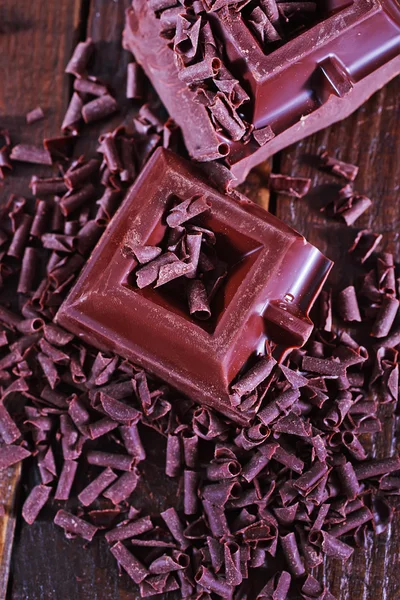 Chocolate on the wooden table — Stock Photo, Image