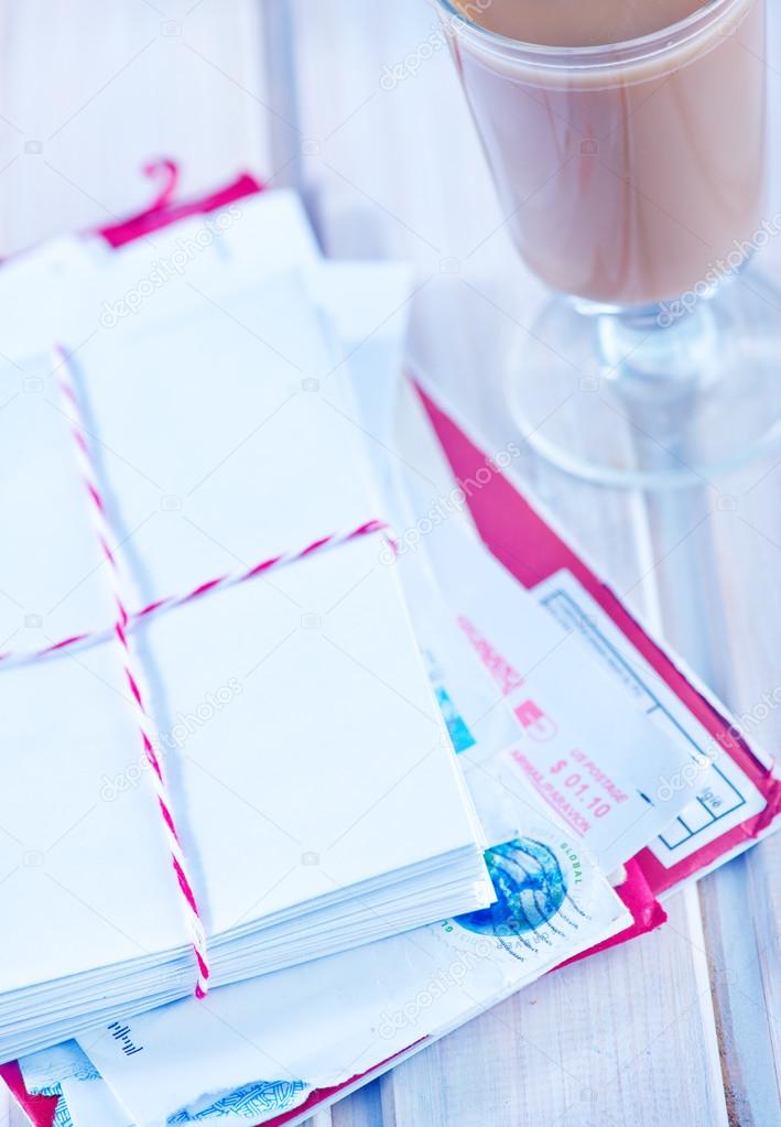 Envelopes and pen on table