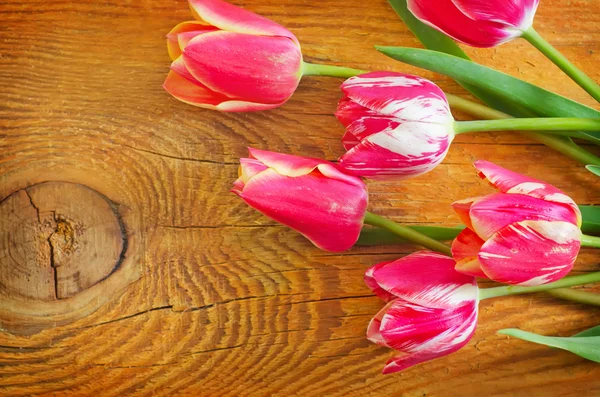 Spring flowers on the wooden table — Stock Photo, Image