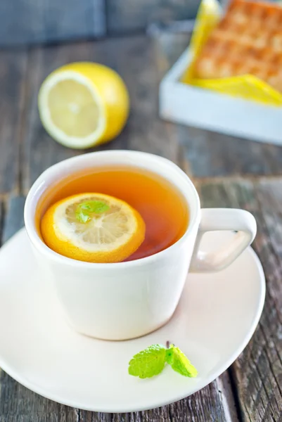 Tea with lemon and waffle — Stock Photo, Image