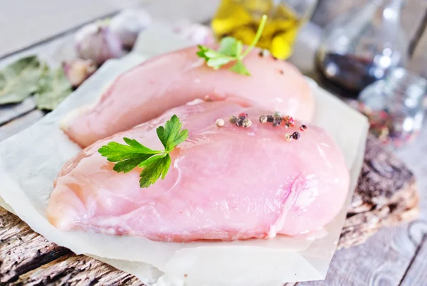 Raw chicken fillet on board — Stock Photo, Image