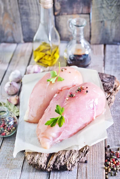 Raw chicken fillet on board — Stock Photo, Image