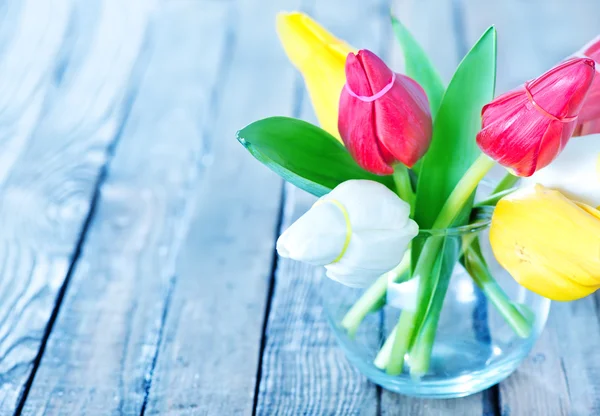 Colorful tulips in vase — Stock Photo, Image