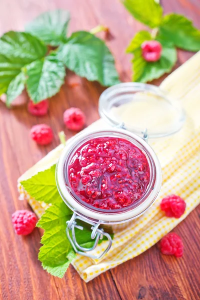 Raspberry jam in glass bank — Stock Photo, Image