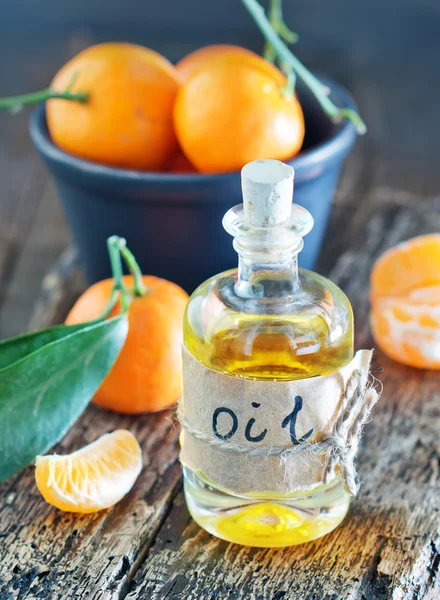 Aroma oil and tangerines — Stock Photo, Image