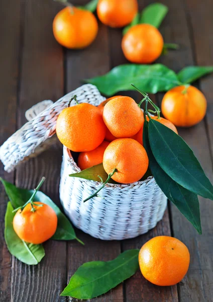 Fresh tangerines in the white basket — Stock Photo, Image