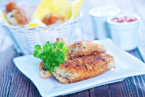 Chicken with sauce on the wooden table — Stock Photo, Image