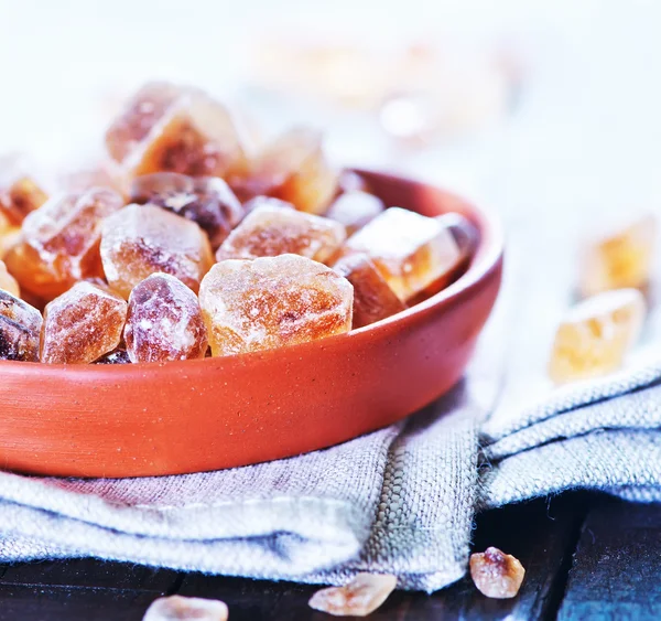 Brown sugar on plate — Stock Photo, Image