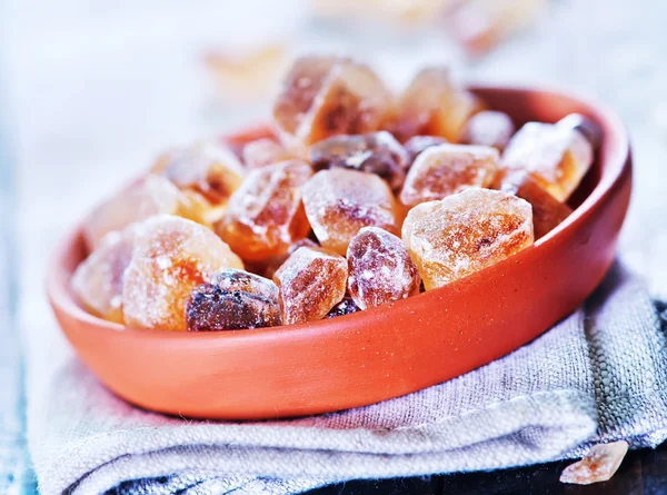 Brown sugar on plate — Stock Photo, Image