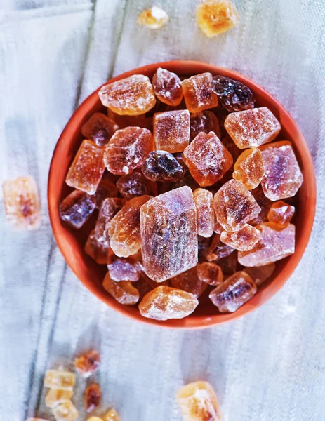 Brown sugar on plate — Stock Photo, Image